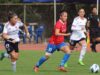 Jugadoras de Colo-Colo y Universidad Católica disputando un balón en un partido por el Campeonato Nacional Femenino.