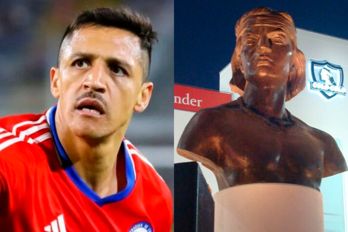 Primer plano al rostro serio de Alexis Sánchez mientras defiende la camiseta de la Selección Chilena, mientras que a mano derecha aparece el indio que se encuentra en el frontis del Estadio Monumental.