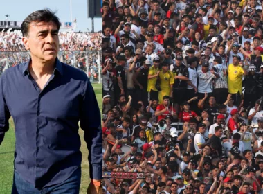 Primer plano a Gustavo Quinteros con camisa y cara de preocupado junto a Garra Blanca en el Estadio Monumental.