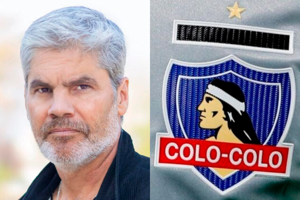 Primer plano al rostro serio del periodista Juan Cristóbal Guarello, mientras que a mano derecha se puede ver el escudo de Colo-Colo.