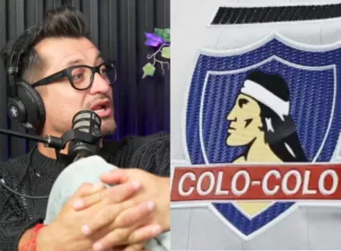 Nicolás Peric hablando en un micrófono junto al escudo de Colo-Colo