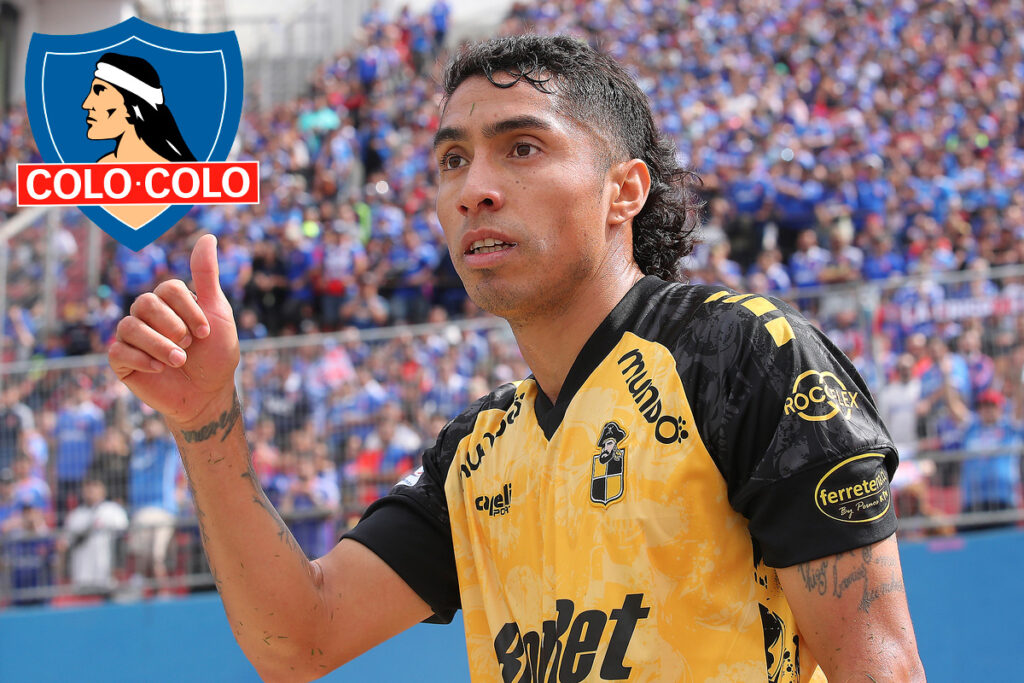 Primer plano de Luciano Cabral con el pulgar arriba. Escudo de Colo-Colo.