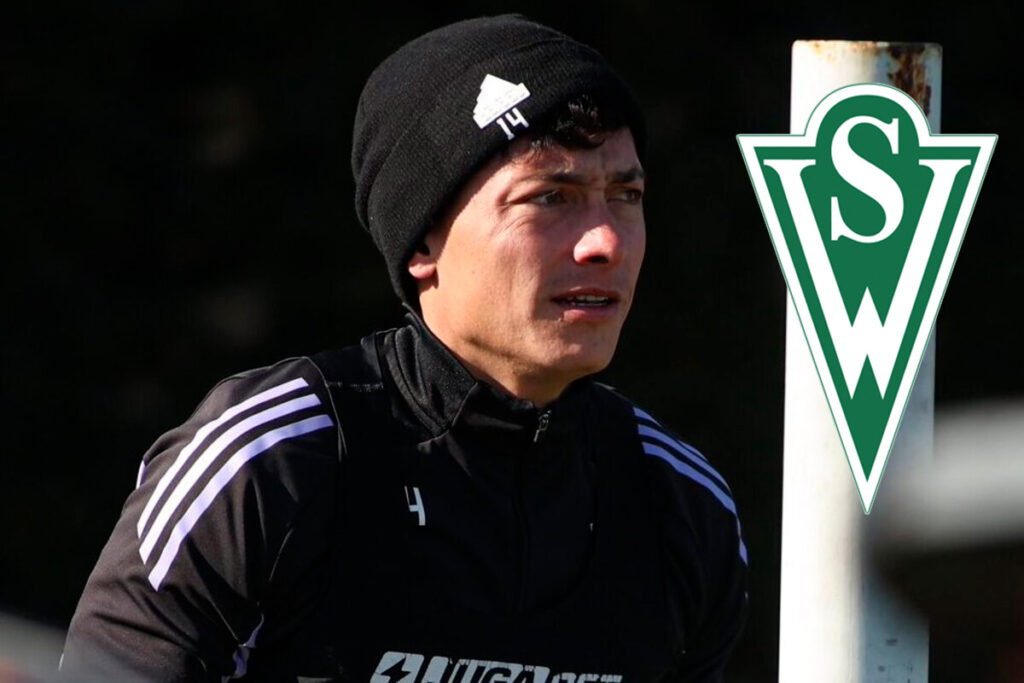 Primer plano de Cristián Zavala junto al escudo de Santiago Wanderers.